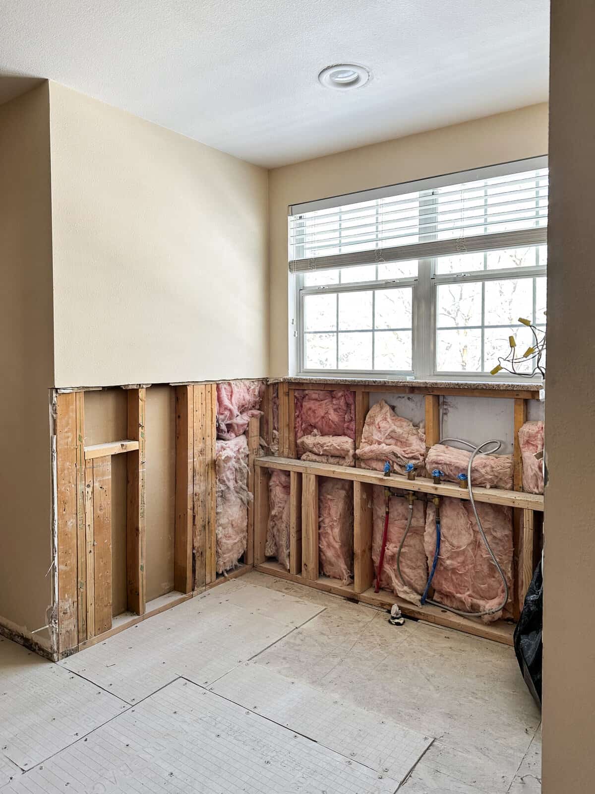 the primary bathroom tub wall after demo
